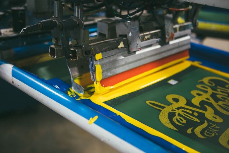 close up of a screen printing press close up of a screen printing press